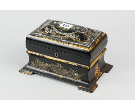 A 19th Century papier mache tea caddy of sarcophagus form with mother of pearl and abalone inlay, gilt decoration and highlig