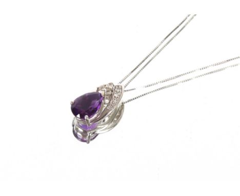 A 9ct white gold diamond and amethyst set necklace, hung to a fine link chain&nbsp;
