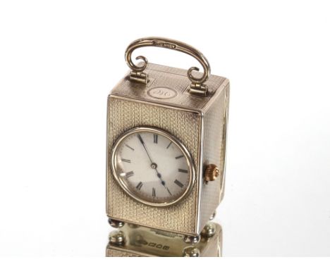 A miniature silver cased carriage clock, the movement inscribed W. Wordley, 129 Cannon Street London, Hallmarked for London 1