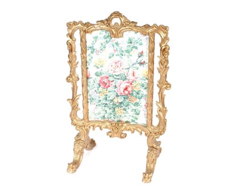 A decorative gilt fire screen in the Rococo manner, having floral panel, 62cm wide x 100cm high&nbsp;