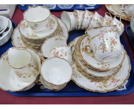 An Early XX Century China Tea Service, decorated with flowers and highlighted in gilt, forty pieces:- One Tray