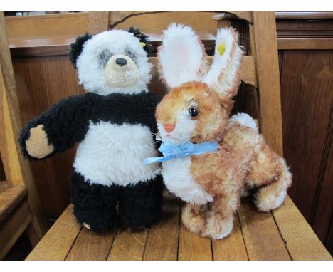 Two Steiff Soft Toy Animals, comprising of a circa 1960's "Ossi" Rabbit, brown eyes, blue bow, measuring approximately 22cm h