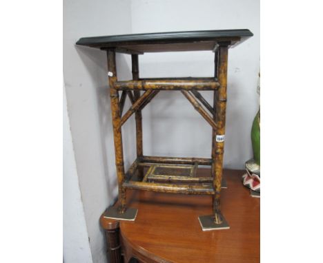 XIX Century Bamboo Table, with a black ebonised top, corner brackets, painted panel to base.