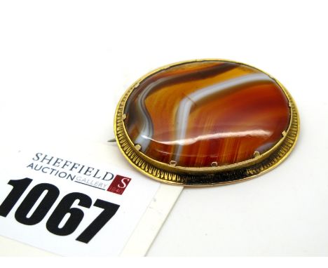 A c.XIX Century Banded Agate Panel Brooch, oval collet set. 