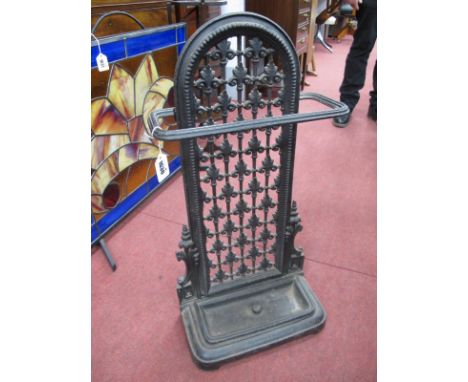 Cast Iron Stick Stand, with openwork Fleur De Lys arched back, detachable drip tray, 72cm high.