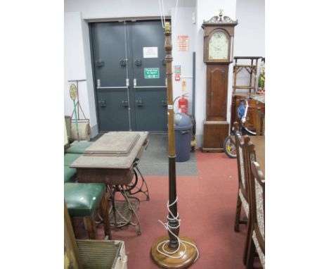 A XX Century Mahogany Standard Lamp, on a circular base.