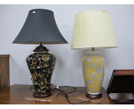 Mandarin Arts Ceramic Table Lamps, both foliate decoration, one on yellow ground, the other wider on black, both with shades.