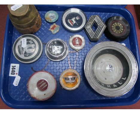 A Collection of Steering Wheel Car Centre Badges, to include Vauxhall and Bedford, plus a hub cap from a Chevrolet.