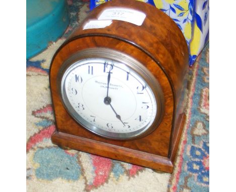 A 15cm high walnut cased mantel clock 