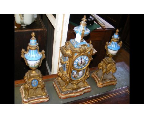 A decorative 19th century French gilt clock, with hand painted porcelain panels in the Sevres style - 49cm high - with the ma