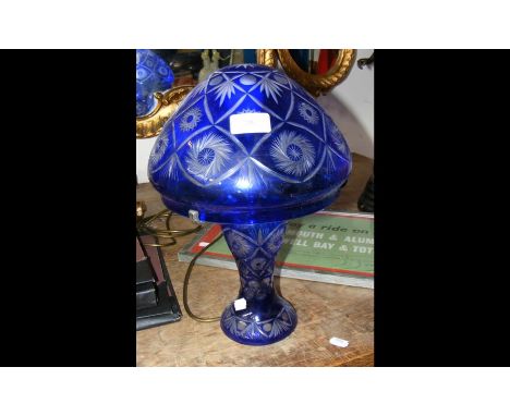 A blue overlay glass table lamp - 36cm high 