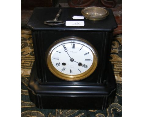 A 23cm high Victorian slate mantel clock by Benson of London 