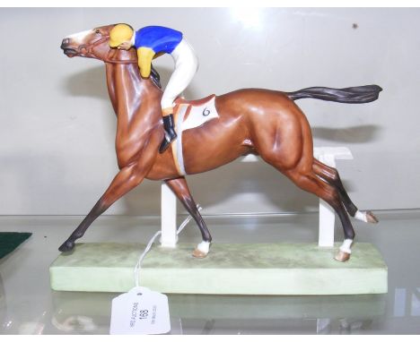 A rare Royal Worcester Jockey on horseback - 'Cantering to The Post' modelled by Doris Lindner - 16cm high 