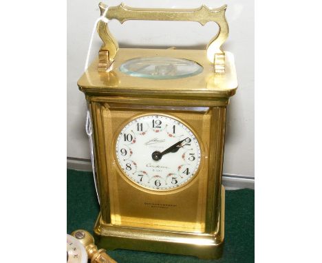A Schmid Contessa 8 Day brass cased clock, retailed by Dimmer &amp; Sons, Southsea - 12cm high 