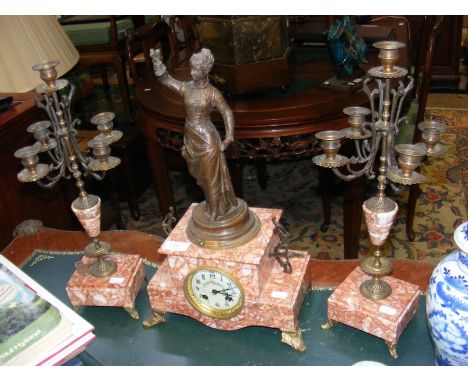 A French three piece clock set with female spelter figure and matching candelabra 