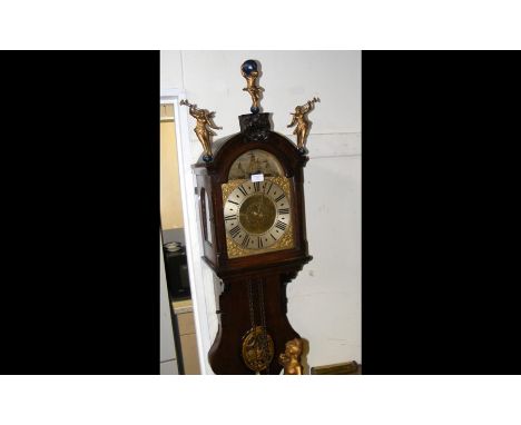 A Dutch wall clock with moving ships in the arched dial, having decorative case and striking on bell - 100cm