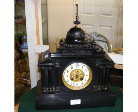 A black slate classical style two train mantel clock with dome to top - height 35cm 