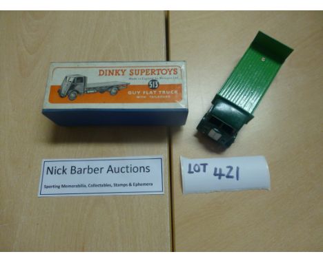 Die-cast :Dinky Supertoys 513 Guy flat truck with tail board dark/light green, both vehicle and box in fine condition.