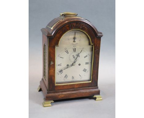   A George III eight day mahogany and brass mounted bracket clock,the silvered arch dial with Roman and Arabic numerals and s