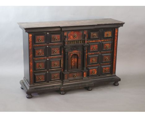   A late 17th century Portuguese ebony and tortoiseshell table cabinet,of breakfront rectangular form and architectural desig