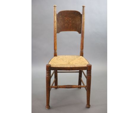  A set of six oak chairs, including a pair of carvers, in the Glasgow School manner by William Birch, High Wycombe,with shap