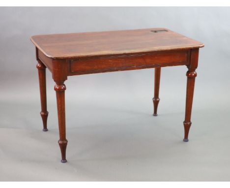   A Victorian mahogany writing table,with rounded rectangular top, once fitted with an inkwell, on turned tapered legs,W.114c