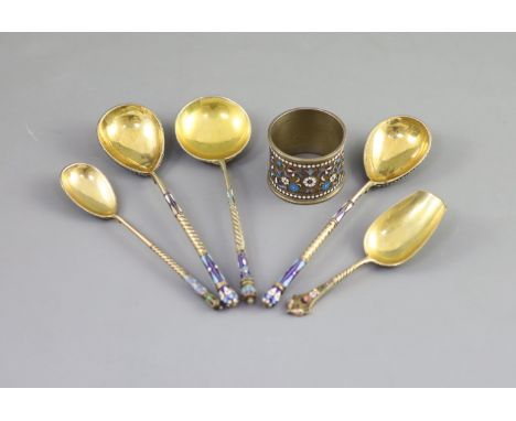   Five assorted late 19th/early 20th century Russian 84 zolotnik silver gilt and cloisonne enamel spoons and a similar napkin