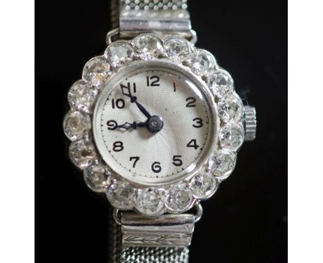   A lady's platinum and diamond set manual wind cocktail watch, on an 18ct white gold mesh link bracelet,the bezel set with s