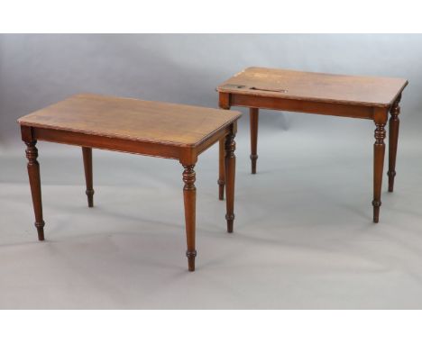   A pair of late Victorian mahogany writing tables,with rounded rectangular tops, one with infilled recesses, the other with 