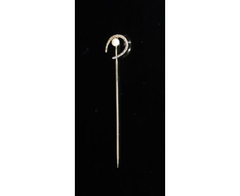   An early 20th century Russian 56 zolotnik gold and seed pearl set horseshoe stick pin by Faberge,signed on the pin, 6mm, gr