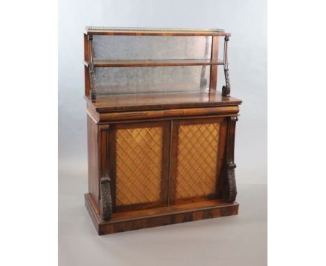   A Regency rosewood chiffonier,the two shelf mirrored back with three quarter brass gallery and acanthus scroll supports ove