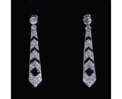   A pair of Cartier Art Deco French platinum, black onyx and diamond set tapering drop earrings,set with round and eight cut 