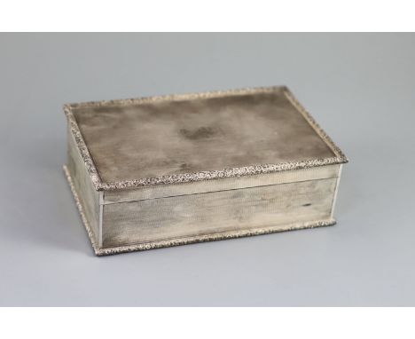   A 1950's engine turned silver rectangular cigarette box, by Mappin &amp; Webb,with foliate borders, London, 1951,21.1cm, gr