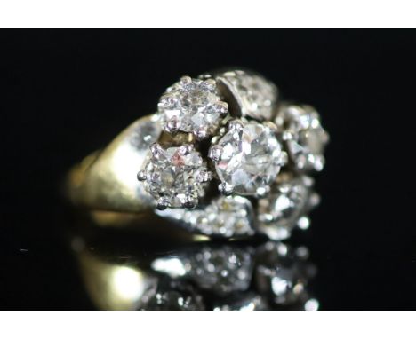   A mid 20th century 18ct gold and five stone diamond cluster ring,with diamond chip setting, total diamond weight approximat