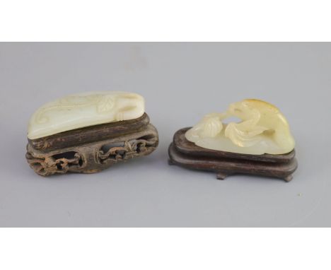   Two Chinese pale celadon jade carvings, 18th/19th century,the first carved as a mandarin duck turning its neck backward to 
