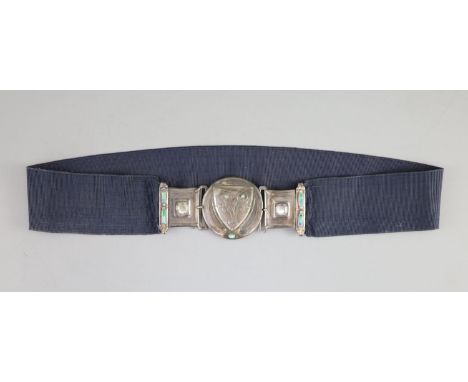   An early 20th century Arts &amp; Crafts silver, enamel, turquoise and cabochon moonstone mounted buckle, on a sash belt,wit