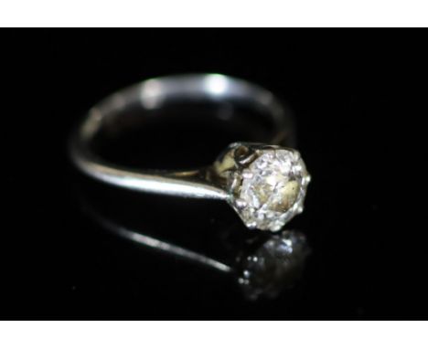   An 18ct white gold and solitaire diamond ring,the stone weighing approximately 1.35ct, size N, gross 3.5 grams.