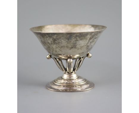   An early 20th century Georg Jensen planished sterling silver circular pedestal bowl,design no. 6, on a stylised leaf and be