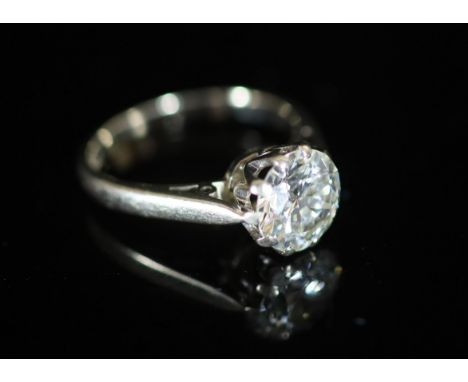   A modern 18ct white gold and solitaire diamond ring,the stone weighing approximately 2.10ct, size M, gross 4.4 grams.