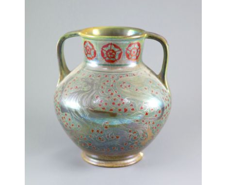   A Pilkingtons Royal Lancastrian lustre two handled vase, by Gordon M. Forsyth,painted with heraldic lions to each side in s