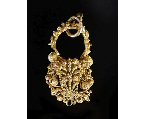   A Georgian cannetille work gold memorial pendant,verso with plaited hair beneath a glazed oval panel, 37mm, gross weight 10