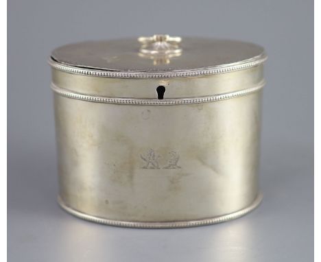   A George III silver oval tea caddy by John Younge &amp; Co,with engraved crest, ring handle and beaded borders, Sheffield, 