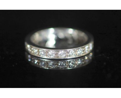   A mid to late 20th century platinum and diamond set full eternity ring,set with twenty one stones with a total approximate 