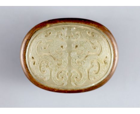   A Chinese pale celadon jade mounted box, 18th/19th century,the archaistic oblong jade plaque carved in relief with stylised