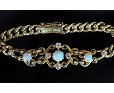   An early 20th century 15ct gold white opal and diamond set curblink bracelet,15cm, gross weight 10.8 grams.