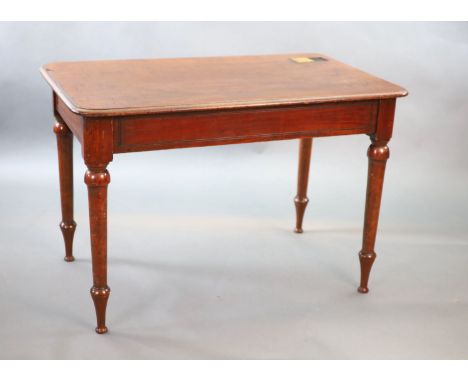   A Victorian mahogany writing table,with rounded rectangular top inset with a brass capped inkwell, on turned tapered legs,W