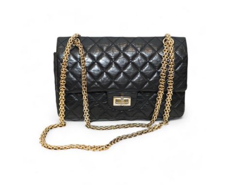 A Chanel 2.55 black leather handbag Three light stains to front, not easily seen; some wear to bottom corners; other signs of