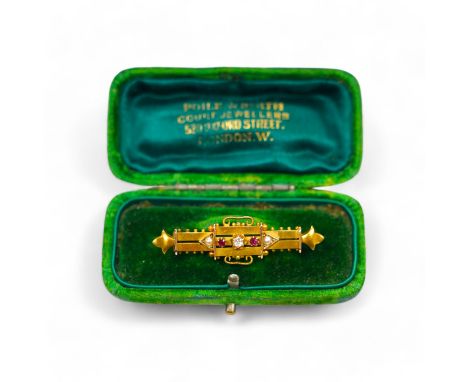 A late Victorian yellow metal (stamped 15), ruby, diamond and seed pearl set bar brooch, 46mm, gross weight 4.2 grams. Condit