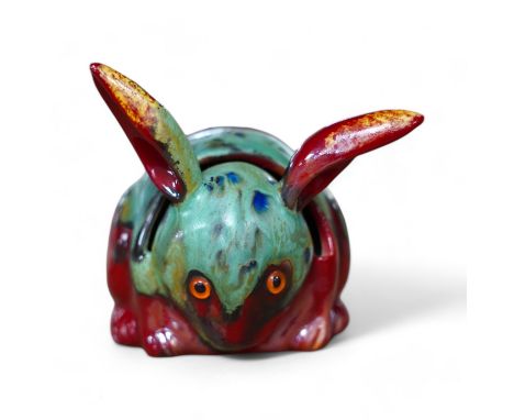 A Bernard Moore rabbit menu holder with inset orange glass eyes, c.1910, signed, 6cm high. Condition - good No damage seen; p