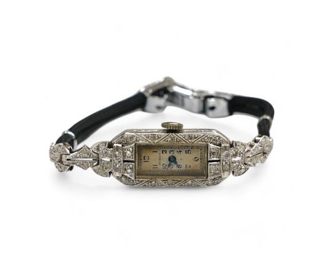 A lady's mid 20th century Buren white metal (stamped platinum) and diamond cluster set manual wind cocktail watch, on a twin 